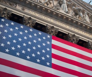 NEW YORK, CIRCA SEPTEMBER 2005 : An American flag hangs on the front of the New York Stock Exchange building in New York City